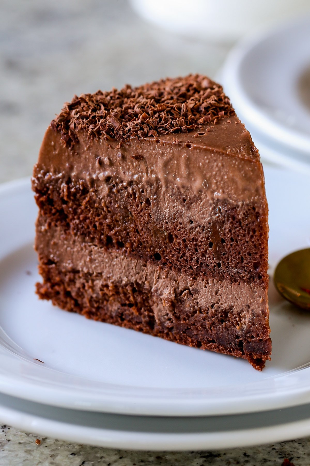 slice of mocha mousse cake on a white plate