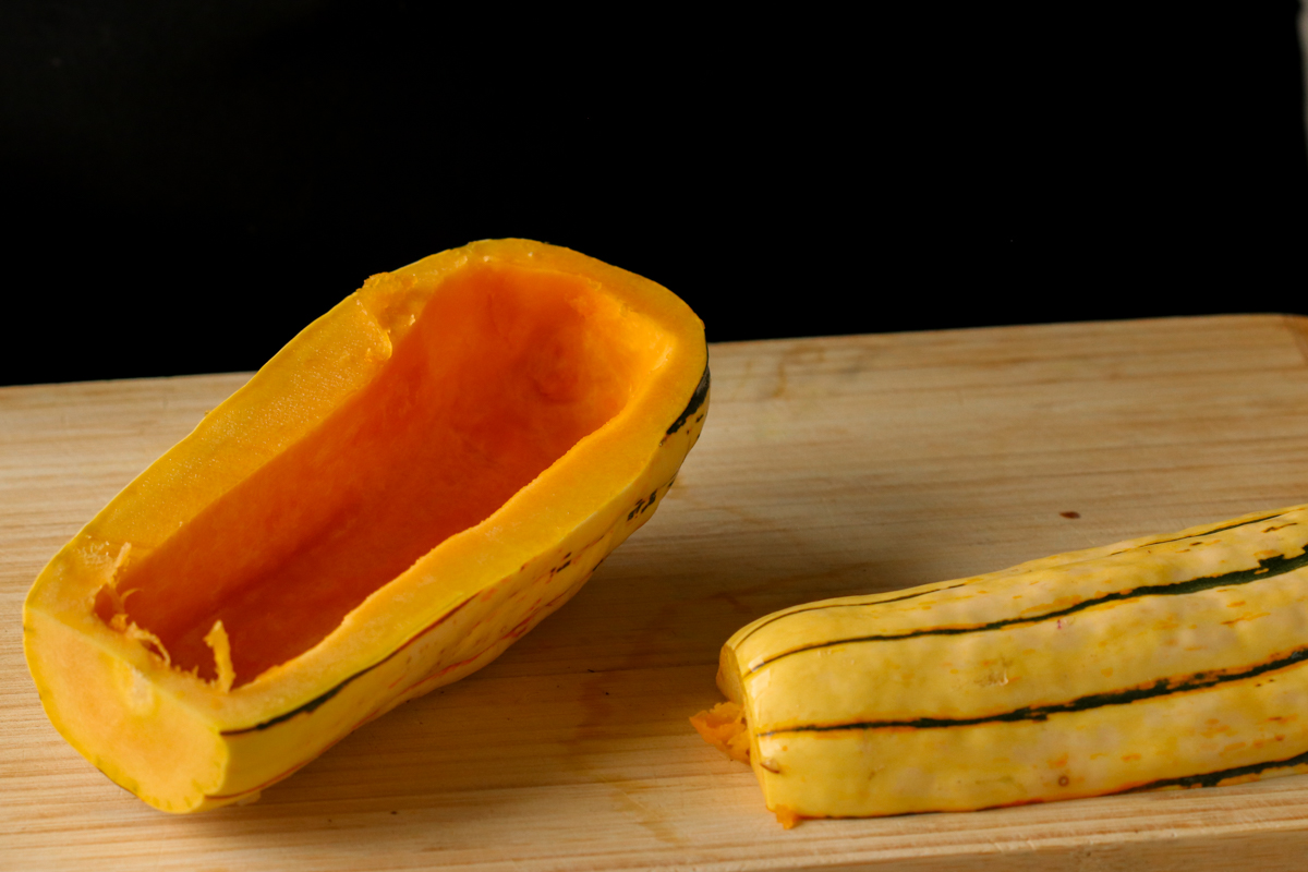 delicata squash sliced in half, seeds removed