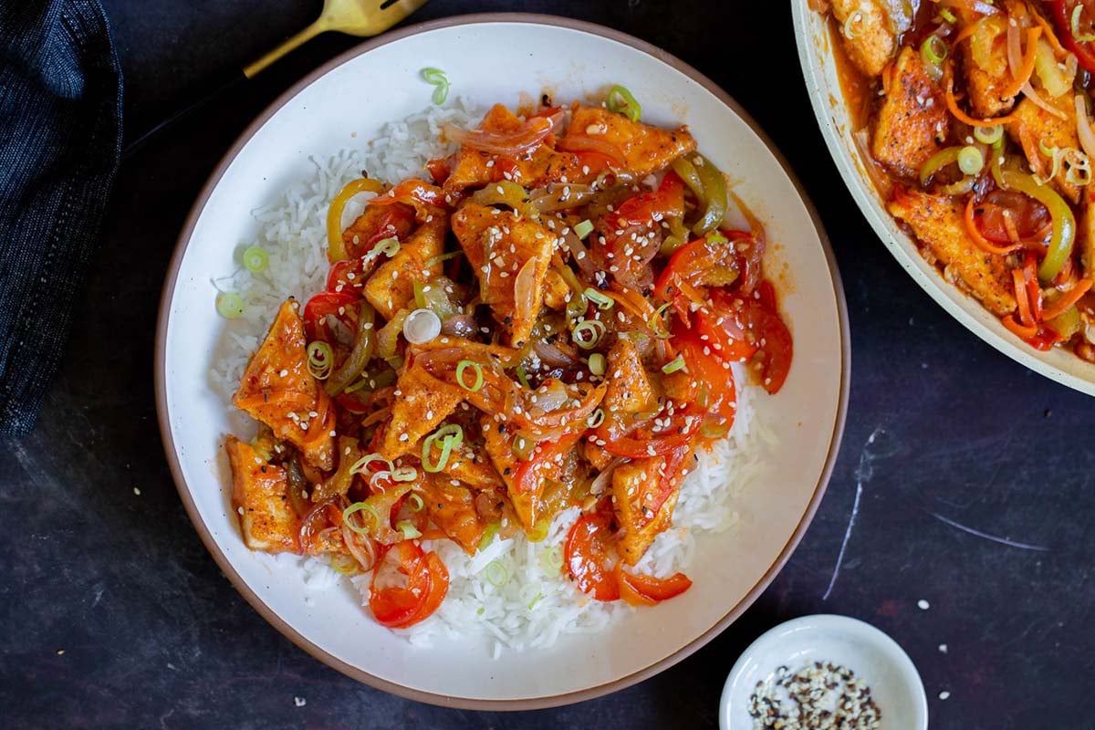 Szechuan tofu on a plate with rice